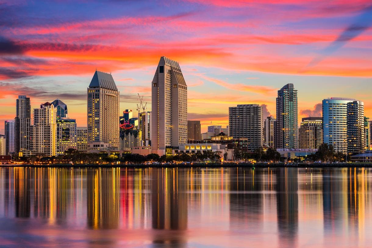 Residential homes with the San Diego skyline in the background.