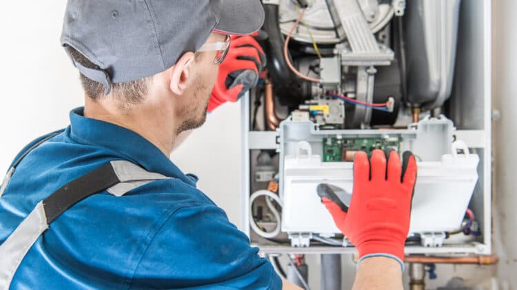 Technician working on a furnace